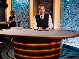 Live Speed Baccarat table showing dealer and card display with betting interface